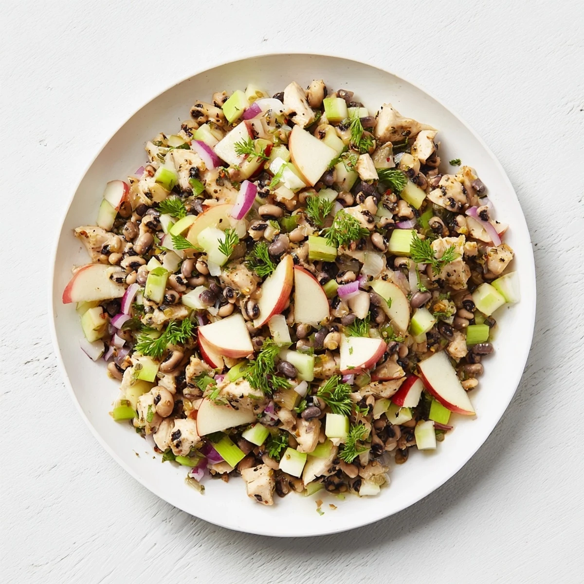 Golden, glistening Chicken and Apple Luck Salad with crisp apples and a creamy dressing ready to enjoy.