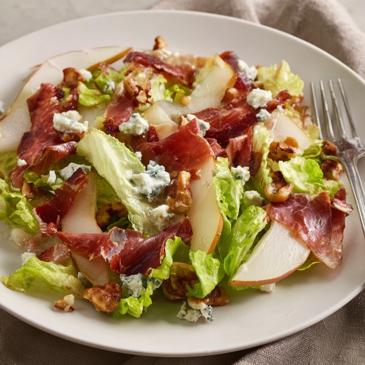 A close-up view reveals the rich textures of this savory salad, perfect for a light lunch or sophisticated starter.
