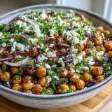 Serving suggestion for chilled Divorce Salad, featuring chickpeas and black beans tossed in a tangy red wine vinaigrette.