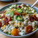 Creamy Corn Salad with Jalapeño offers a refreshing mix of crisp veggies and smoky spices.
