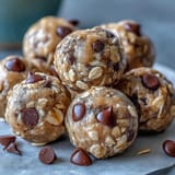 Golden-brown Snack-Sized Protein Balls rolled in oats, ready for enjoyment.