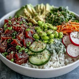 Colorful canned tuna poke bowl topped with creamy avocado and crunchy radishes.