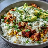 Hearty Street Corn Chicken Rice Bowls featuring spiced chicken and charred corn.