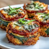 Savory zucchini tomato bake topped with golden brown, crunchy Parmesan breadcrumb perfection.