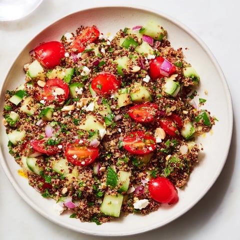 Bright, colorful photo of the make-ahead quinoa salad ready to serve on a plate.