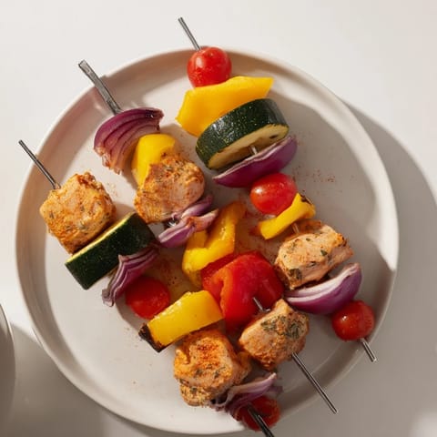 These juicy Chicken and Veggie Skewers showcase tender chicken with colorful, caramelized vegetables.