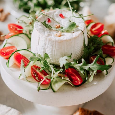 The artful Zenith Point salad: arugula, tomatoes, and radish meet a creamy cheese centerpiece.