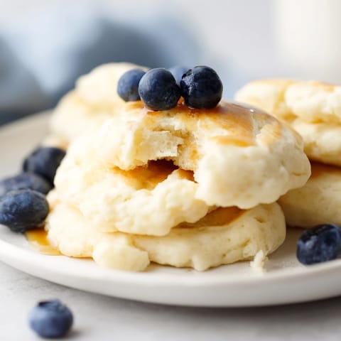 Warm, tender fluffy scrambled pancakes in a skillet, perfect for a weekend breakfast treat.