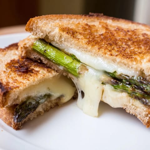 Asparagus & Brie grilled cheese on toasted sourdough, perfect for a quick lunch or light dinner.