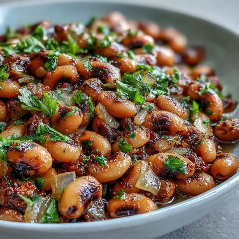 Fork-tender Frozen Black-Eyed Peas Quick Version simmered in a savory broth with onions, garlic, and a pinch of smoked paprika.