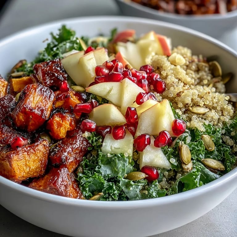 Roasted sweet potatoes and fluffy quinoa fill this Kale Harvest Grain Bowl with warm, hearty flavors for a healthy lunch.