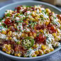 Creamy Corn Salad with Jalapeño bursting with sweet corn, crunchy vegetables, and zesty lime dressing.