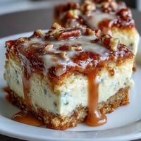 Moist carrot cake cheesecake bars with creamy layers and crunchy walnuts, perfect for spring dessert tables and holiday gatherings.